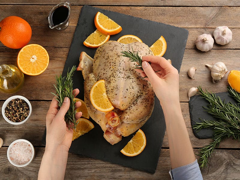 Adding Rosemary Raw Chicken